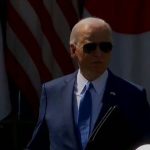 President Biden talks about Ukraine aid at a press conference.
